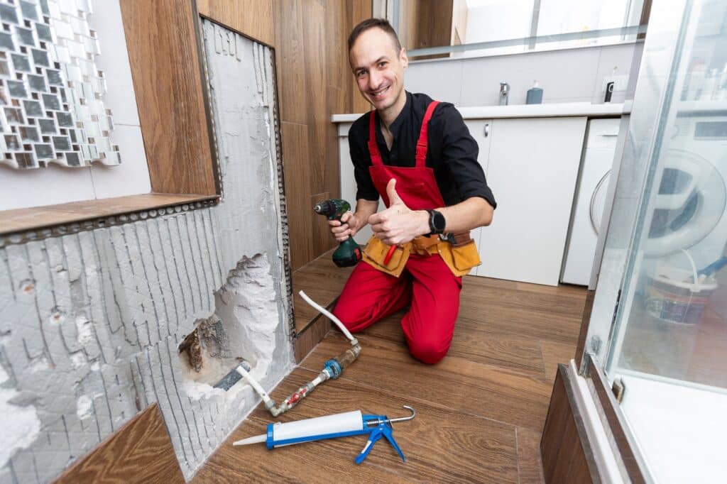 Plumber working in the bathroom